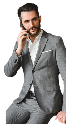 Real estate professional in a suit on a phone call, representing career opportunities at Estate Properties