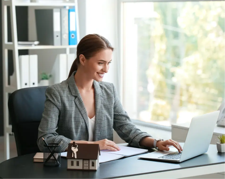 woman using advanced real estate technology tools on a laptop