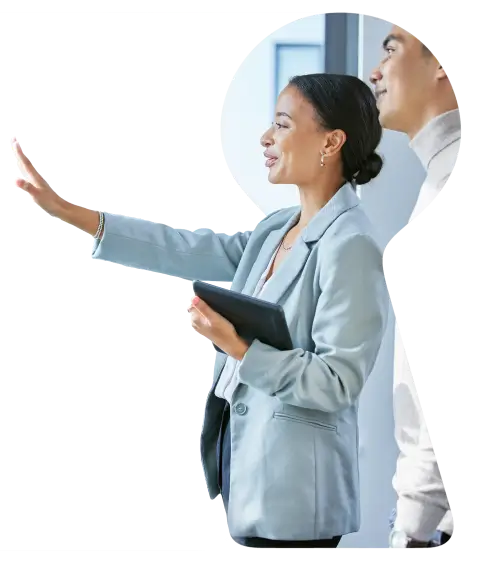 Real estate agent showing property to client, seen through a keyhole-shaped cutout design